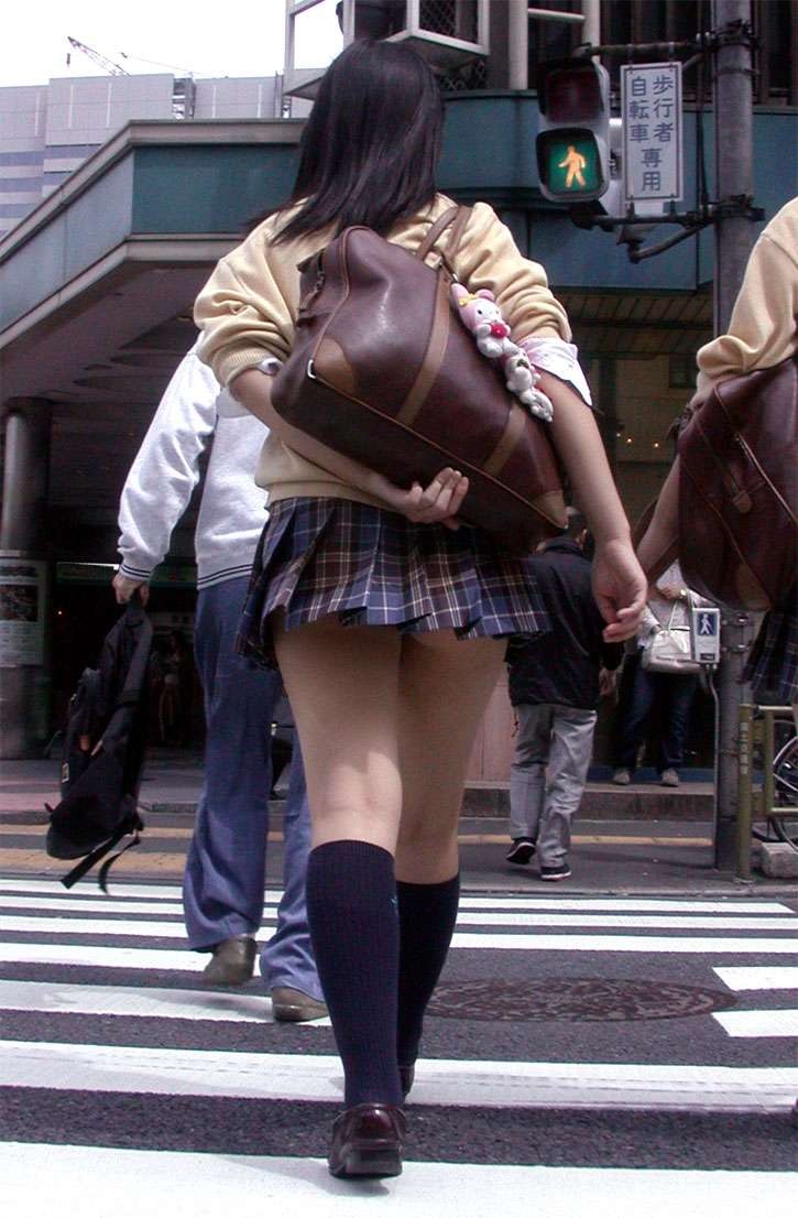 Japanese girls lift skirts