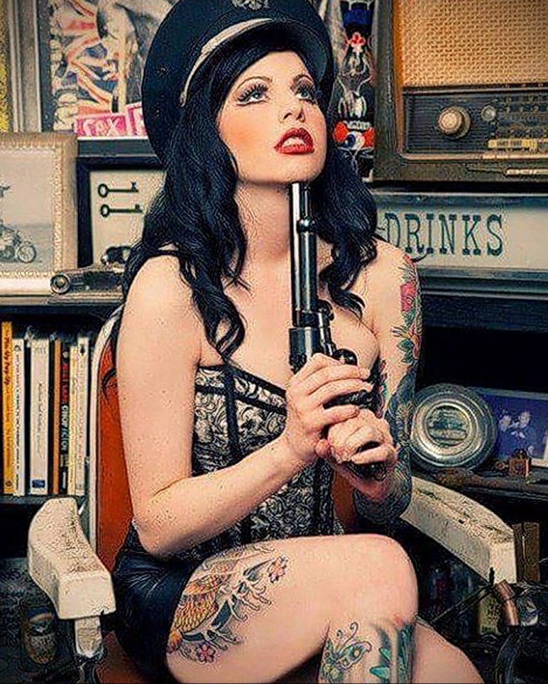 Thin granny in a bra with tattoos