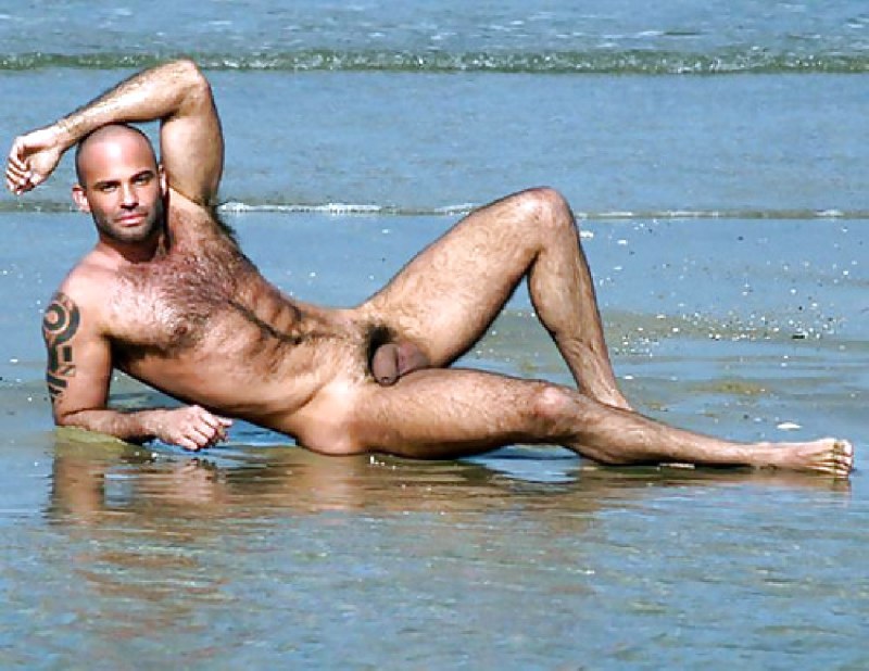 Naked guy on a public beach