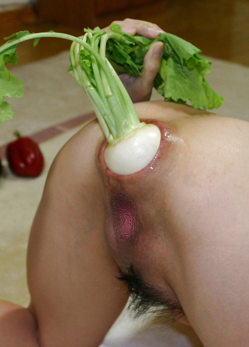 Huge cucumber in the pussy