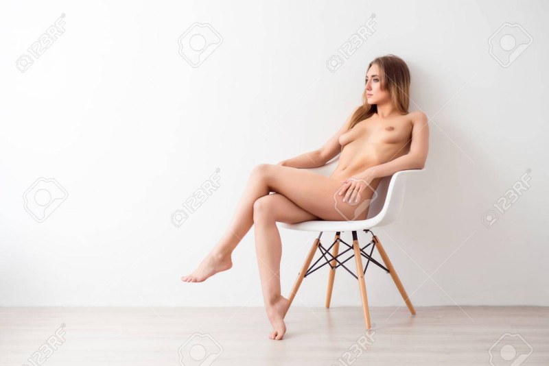 Erotic poses in an armchair