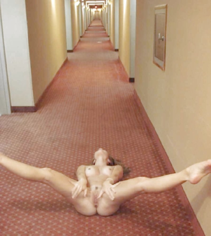 Naked wife in the corridor of the hotel