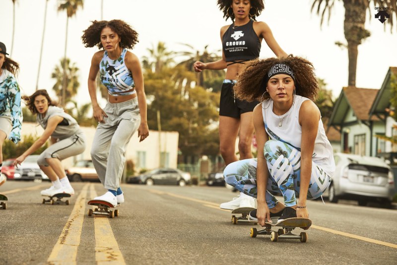 Girls in shorts on the background of a car