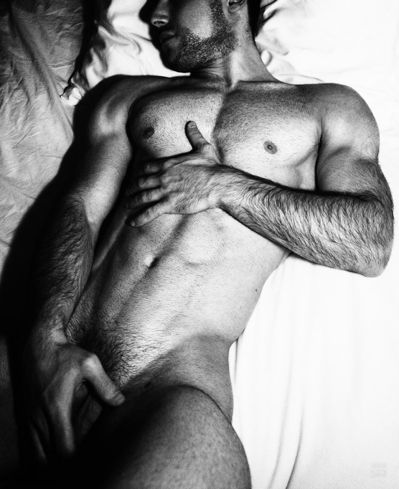 Two naked guys in bed