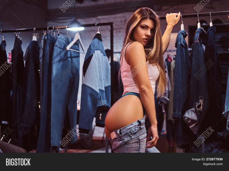 The girl is trying on the dress
