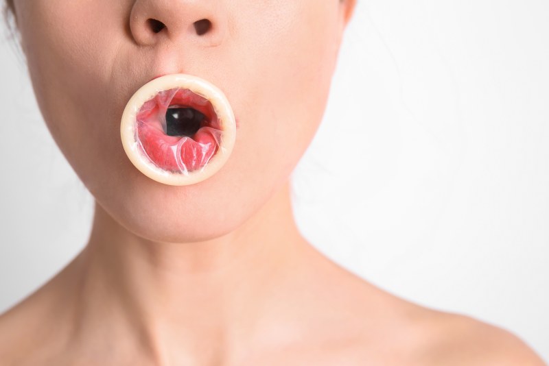 Girl with a Person in her mouth