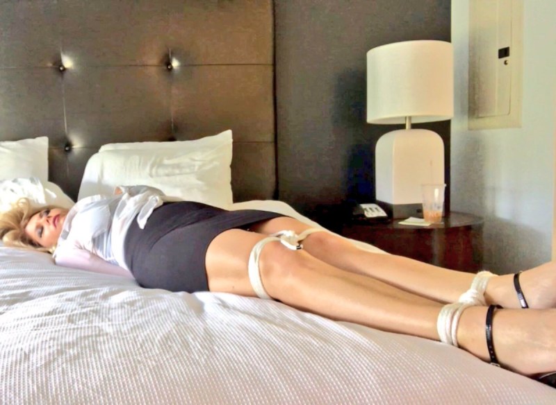 Bondage girl on the bed