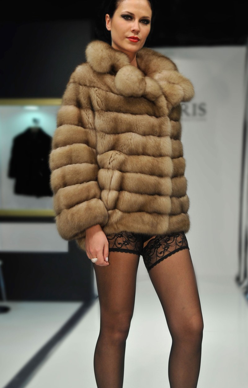Girls are connected in fur mittens