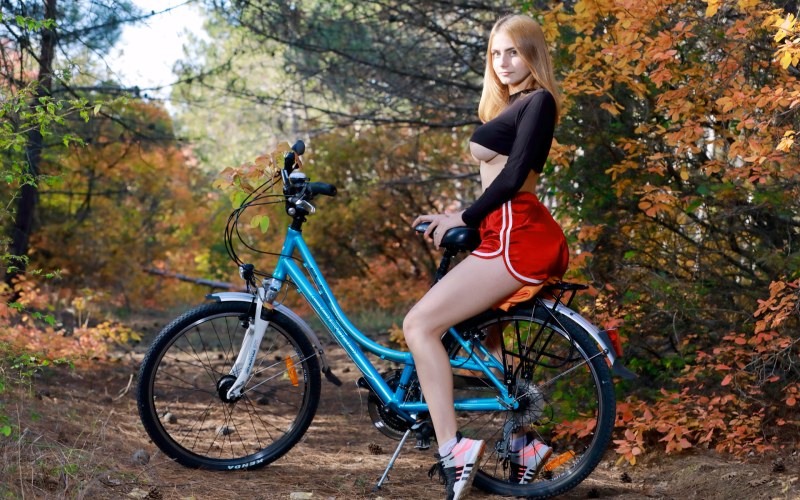 Dakota Pink on a bicycle