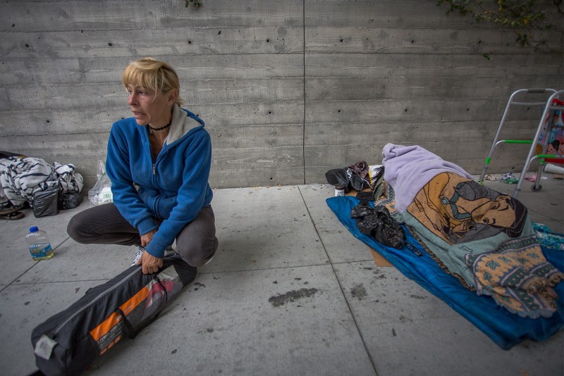 Homeless with a Help sign