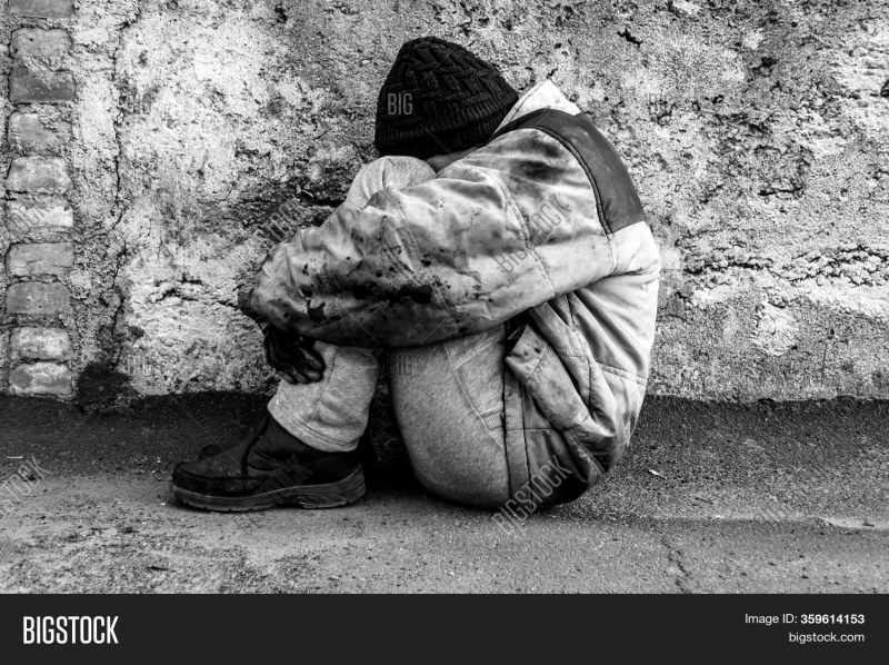 A homeless woman is crying