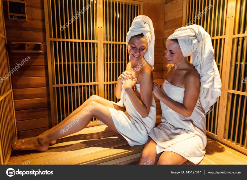 A guy in a sauna with chicks