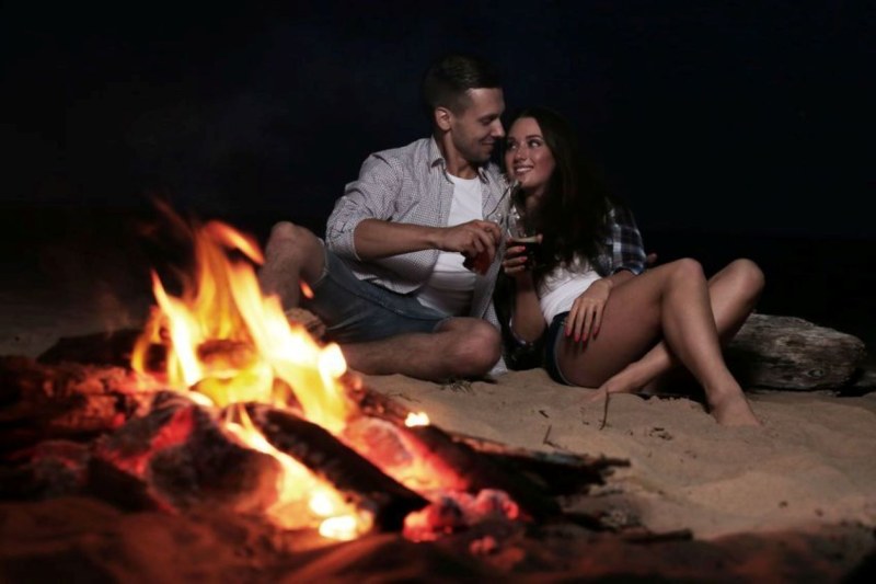 A man and a woman by the fire