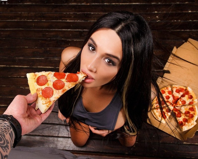Girl with pizza in her hands