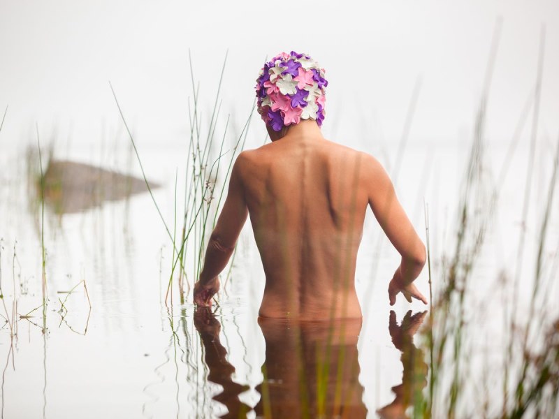 Yana on the river naked in a towel