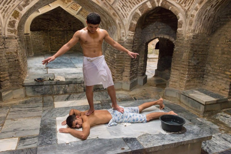 Girl in a towel with a man