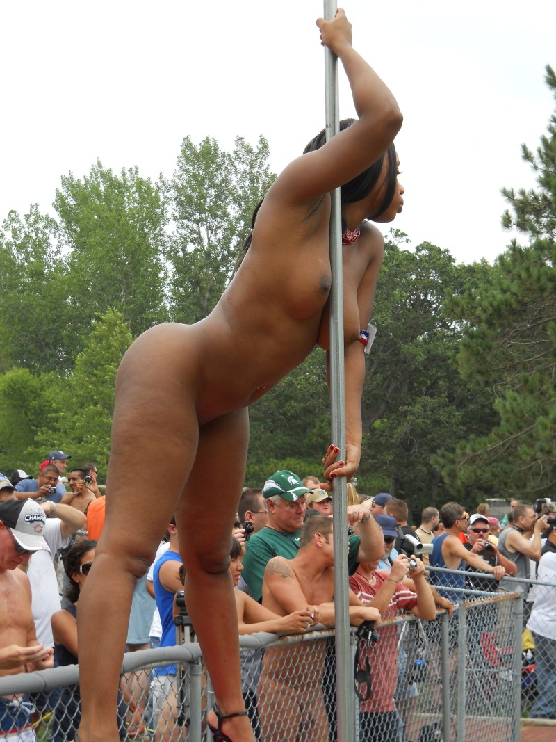 Naked gymnastics on a pole