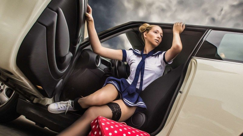Girl in stockings in the car
