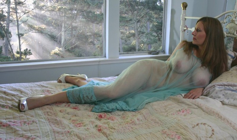 Mature blonde in bed