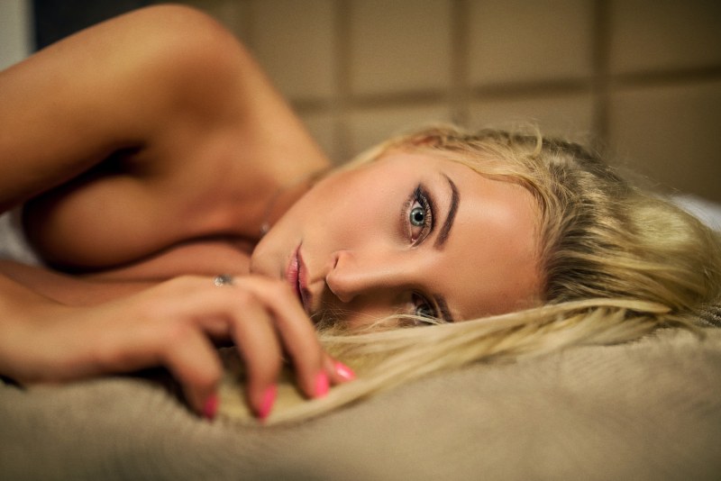 Naked blonde with blue eyes