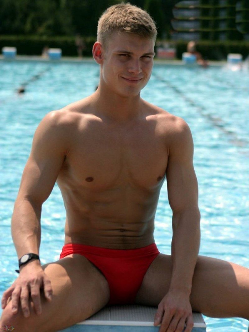 Beautiful young guys in swimming trunks