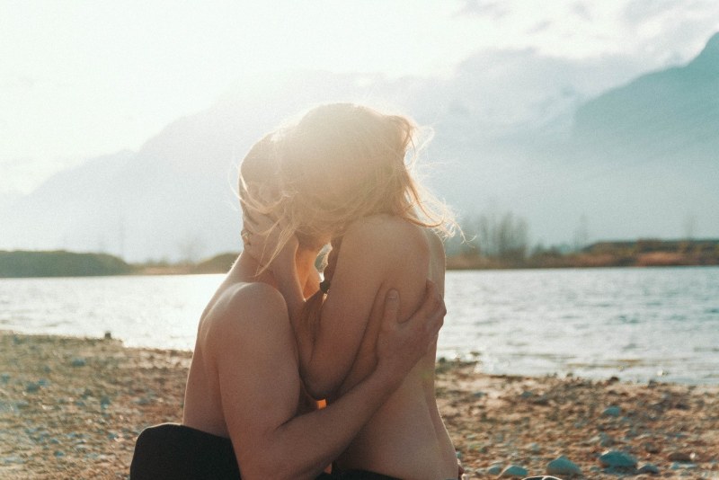 The couple hugs at sea