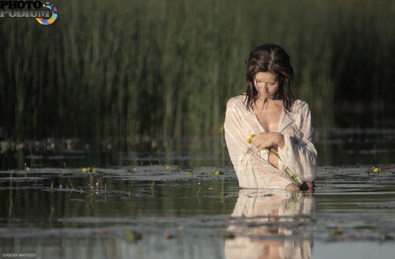 Girl to the waist in water