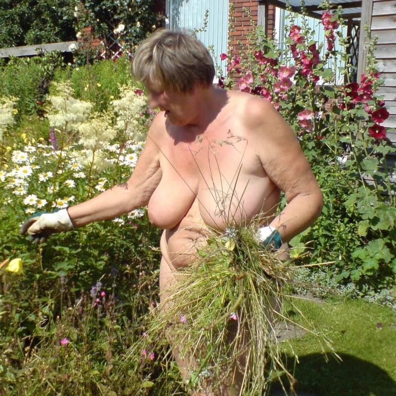 Naked grandmother in the village in the shower