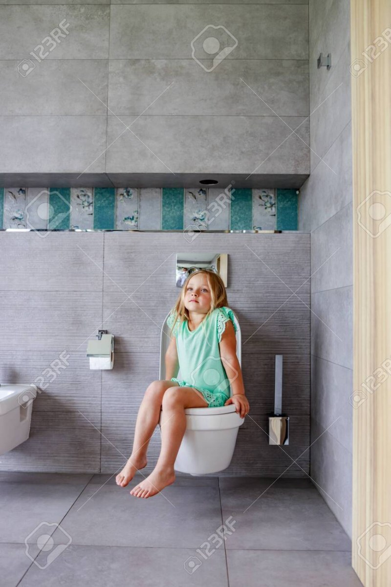 Young girl on the toilet