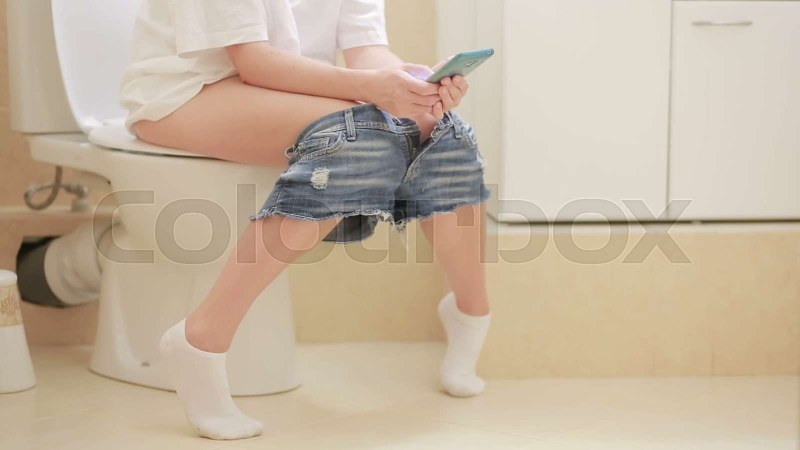 The girl reproaches in the toilet