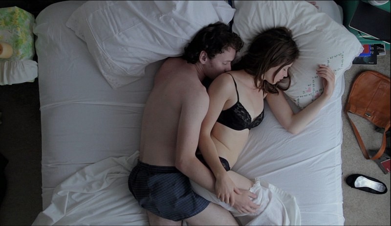 In bed with a pregnant woman