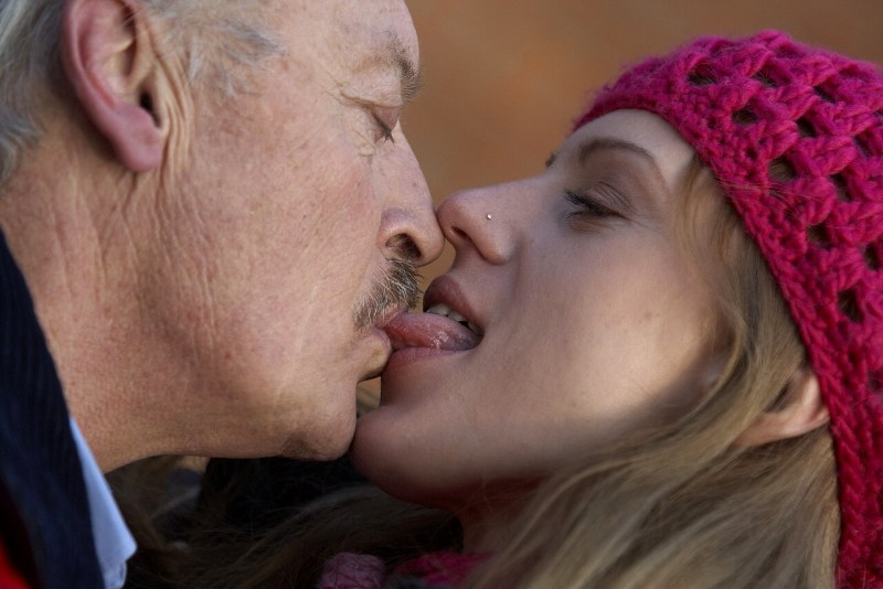 Old man and young kiss