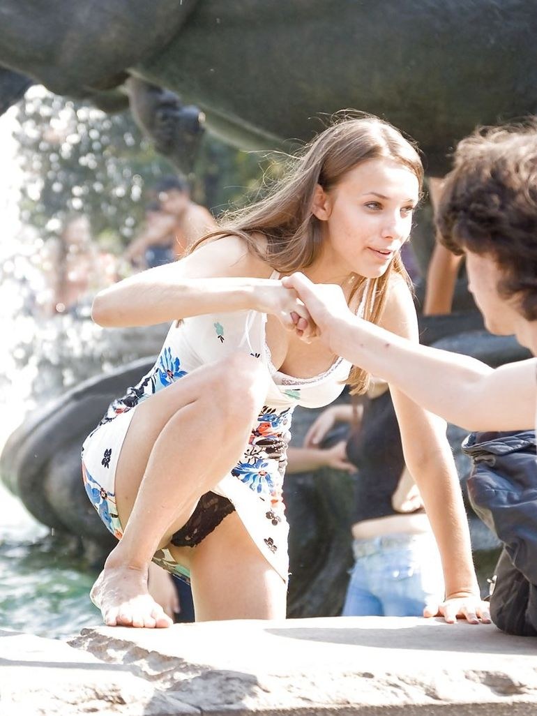 The girl in a short dress bent down