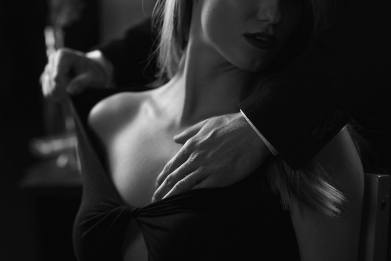 Male hand on a female chest