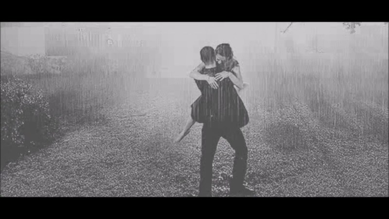 The couple dances in the rain