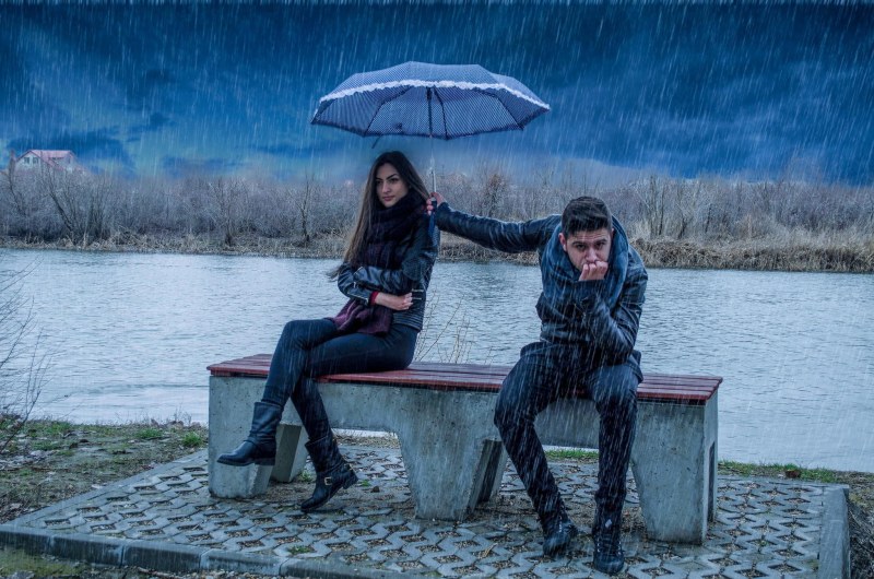 Guy and girl in the rain