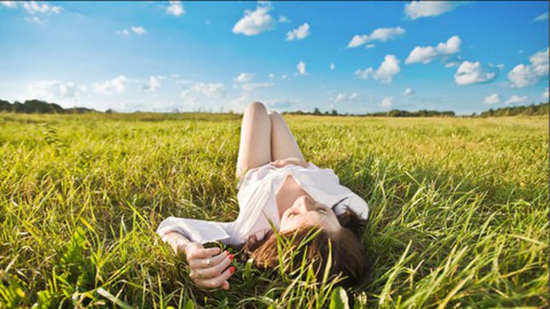 Blonde lies on the grass