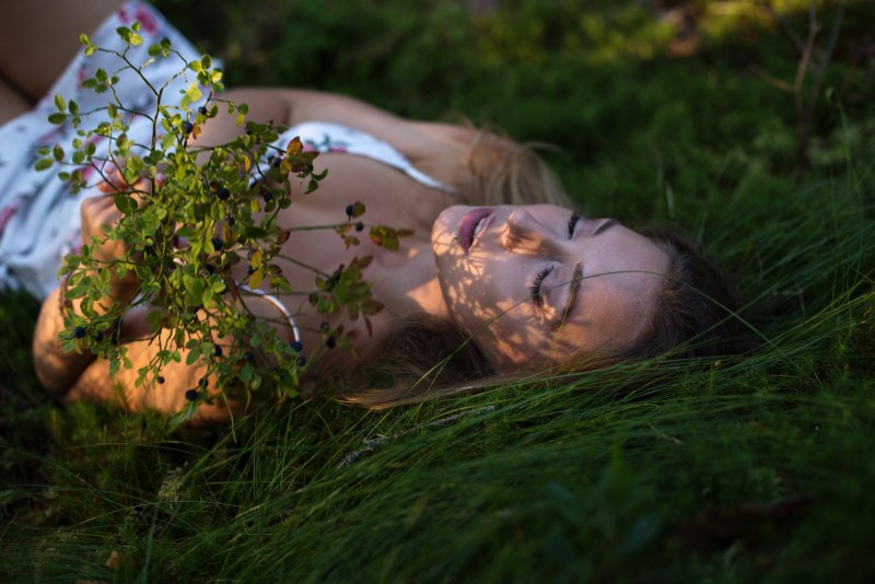 Woman lies on the grass