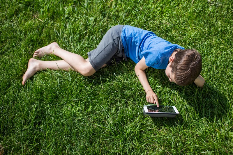 Girls on the grass with elongated legs