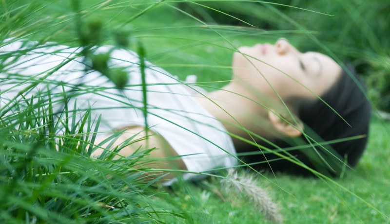 The man lies on the lawn