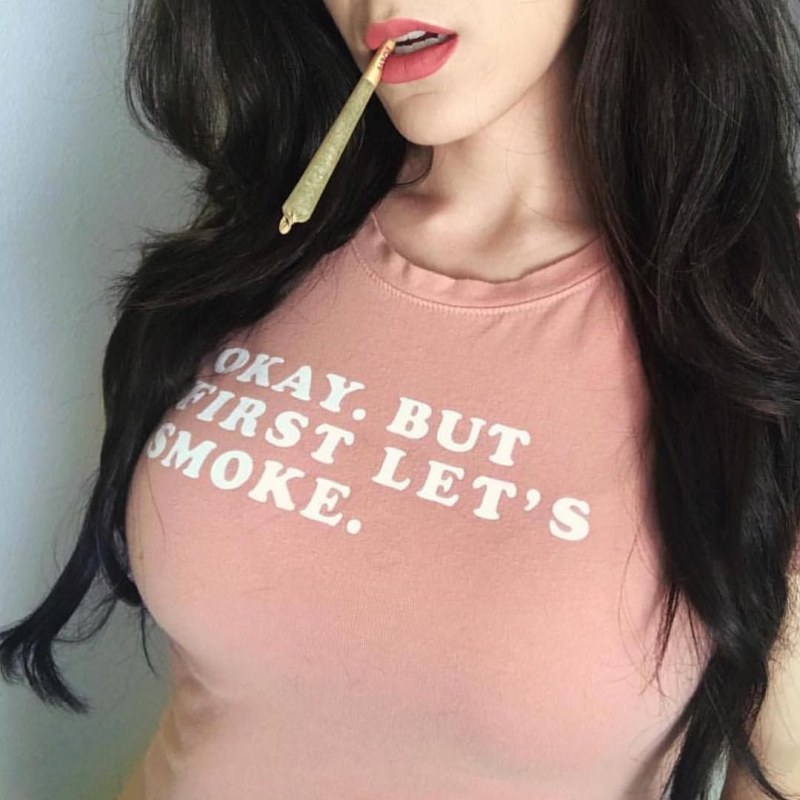 The girl smokes Bong