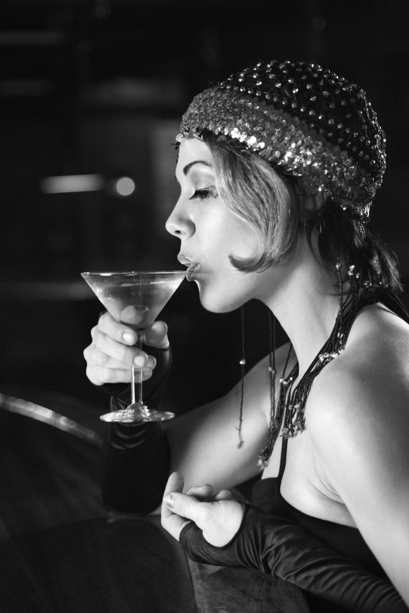 A retro picture of a woman drinks