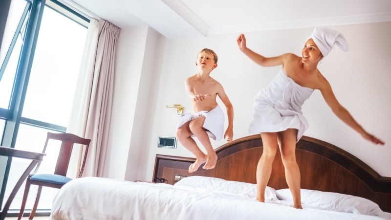 The silhouette of a woman and a child at sunset