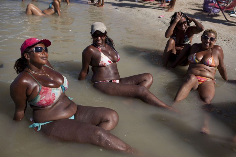 Fat black woman on the beach