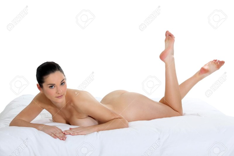 Naked woman lies on the bed
