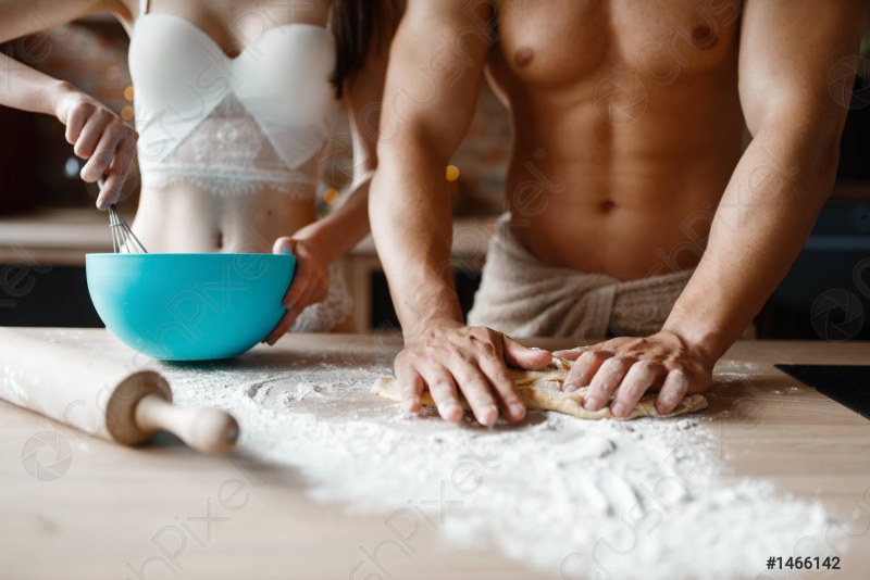 I hug in the kitchen from the back