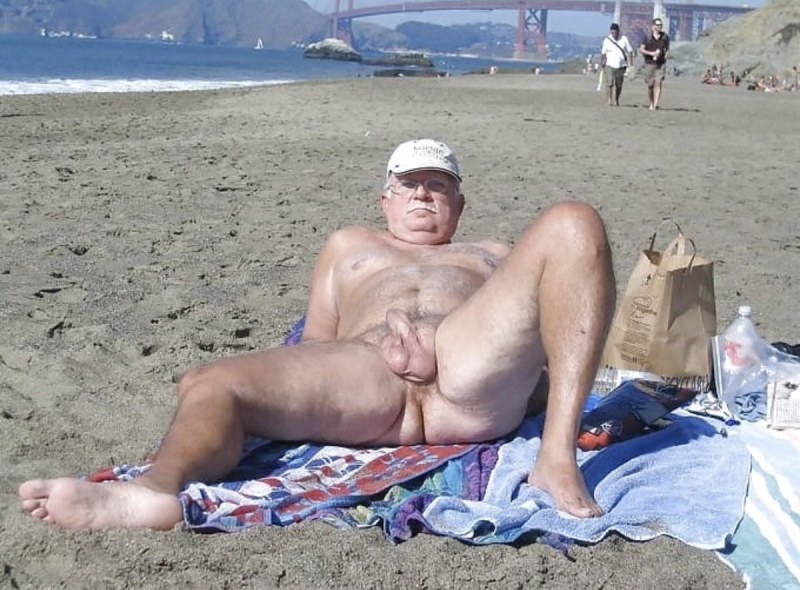 Naked old people with an erection on the beach