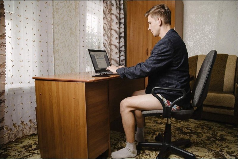 In shorts at the computer