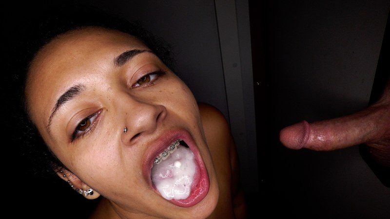 A beautiful brunette sucks a dick