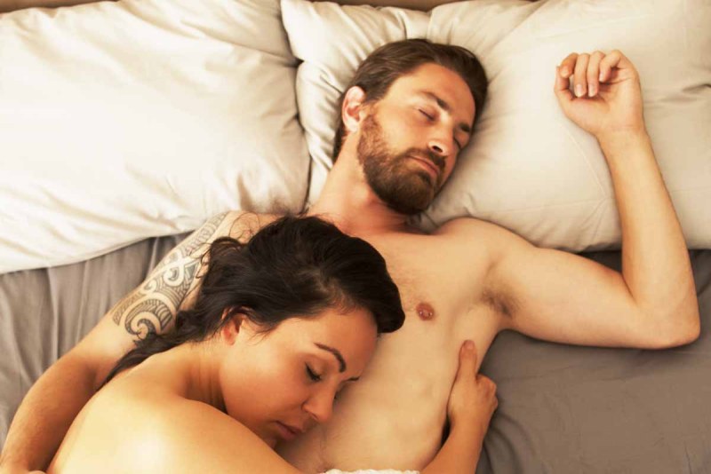 Man and woman in white bed